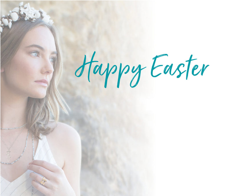 Happy Easter script over photo of young woman wearing white flowers in her hair and white dress, My Saint My Hero necklaces