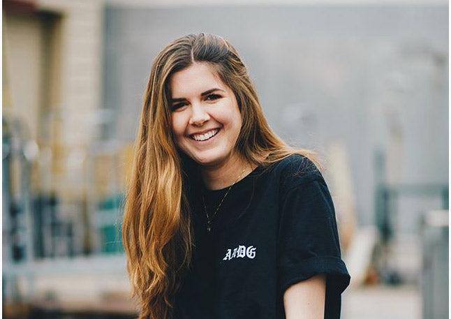 smiling Maclaine wearing black t-shirt
