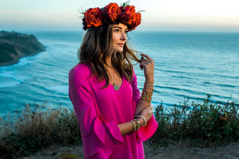 Mary Star of the Sea Blog Girl in floral rose headpiece by ocean cliff