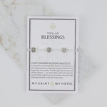 Stellar Blessings crystal blessing bracelet with silver tone St. Benedict Medals on an inspirational card