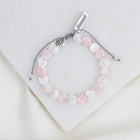 Bracelet with heart-shaped beads on a white background