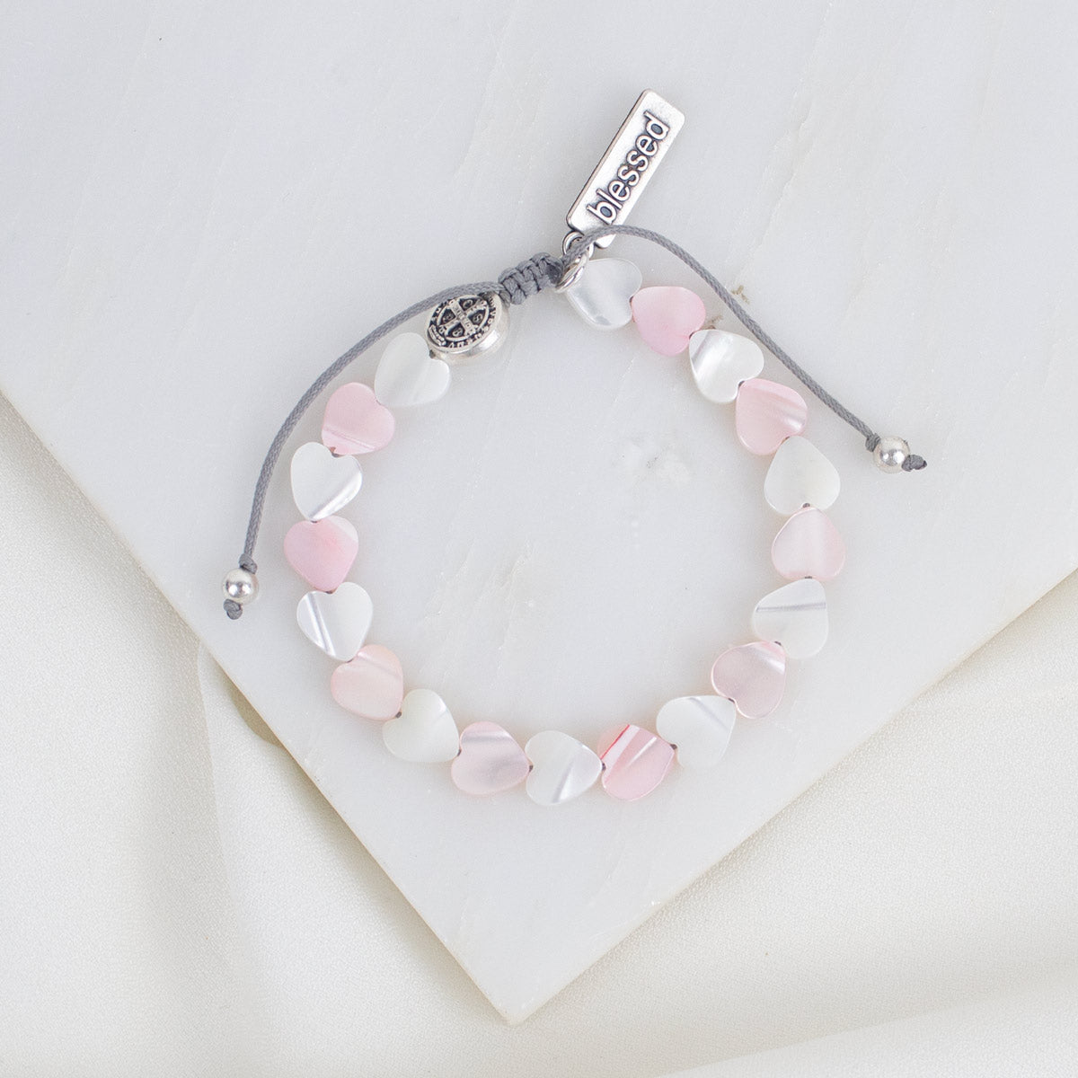Bracelet with heart-shaped beads on a white background