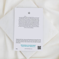 Wearable Blessings card with prayer text on a white background