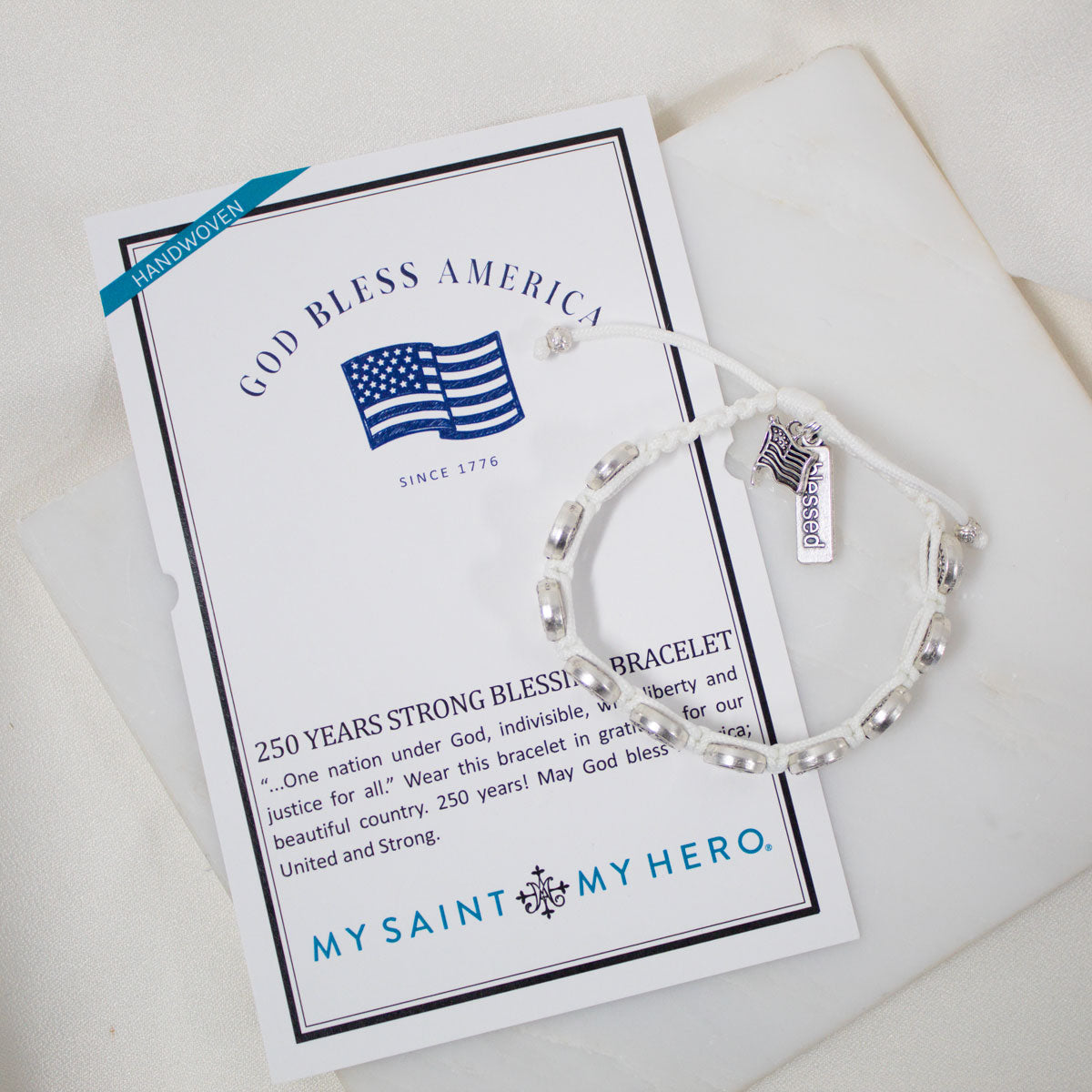 Silver bracelet on a card with 'My Saint My Hero' branding
