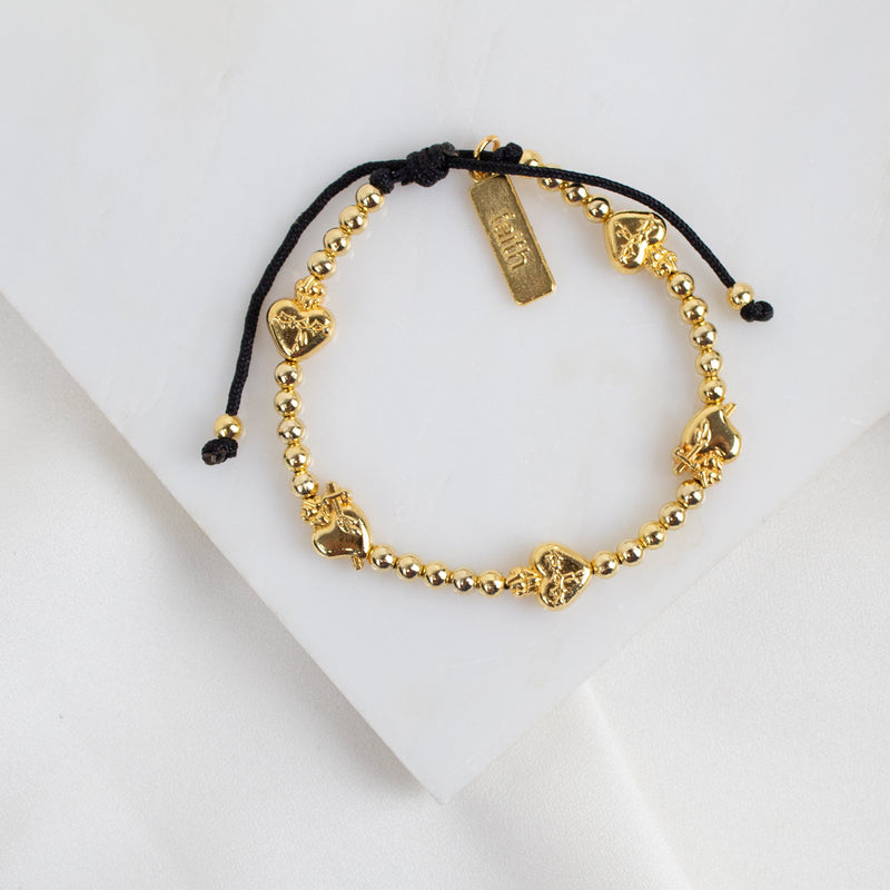 Sacred Heart medals and beads in gold tone on black cording, slipknot style bracelet with faith charm