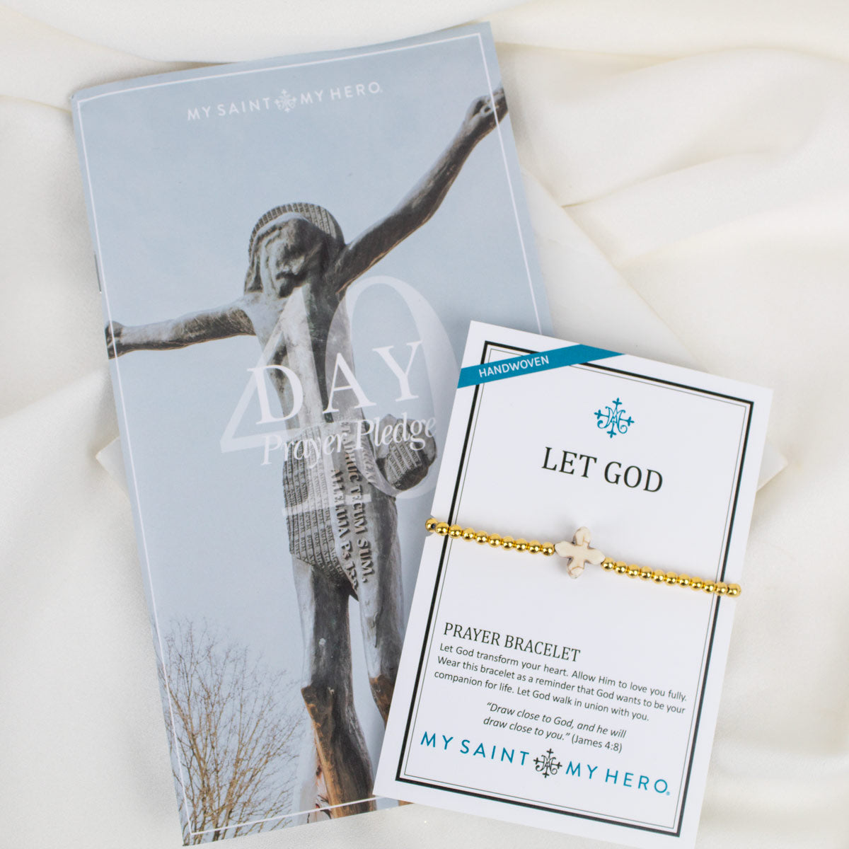 40 Day Prayer Pledge Booklet and Let God Prayer Bracelet with gold beads and a white howlite cross at the center.