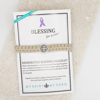 Men's tan woven Blessing for a Cure Bracelet featuring a silver-tone Benedictine medal on its product display card.