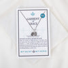 Necklace on a 'Garment of Grace' card with 'My Saint My Hero' branding.