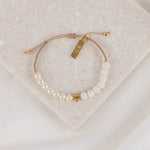 Heirloom crystal pearls and white lava beads with gold cross and faith charm on tan woven cording