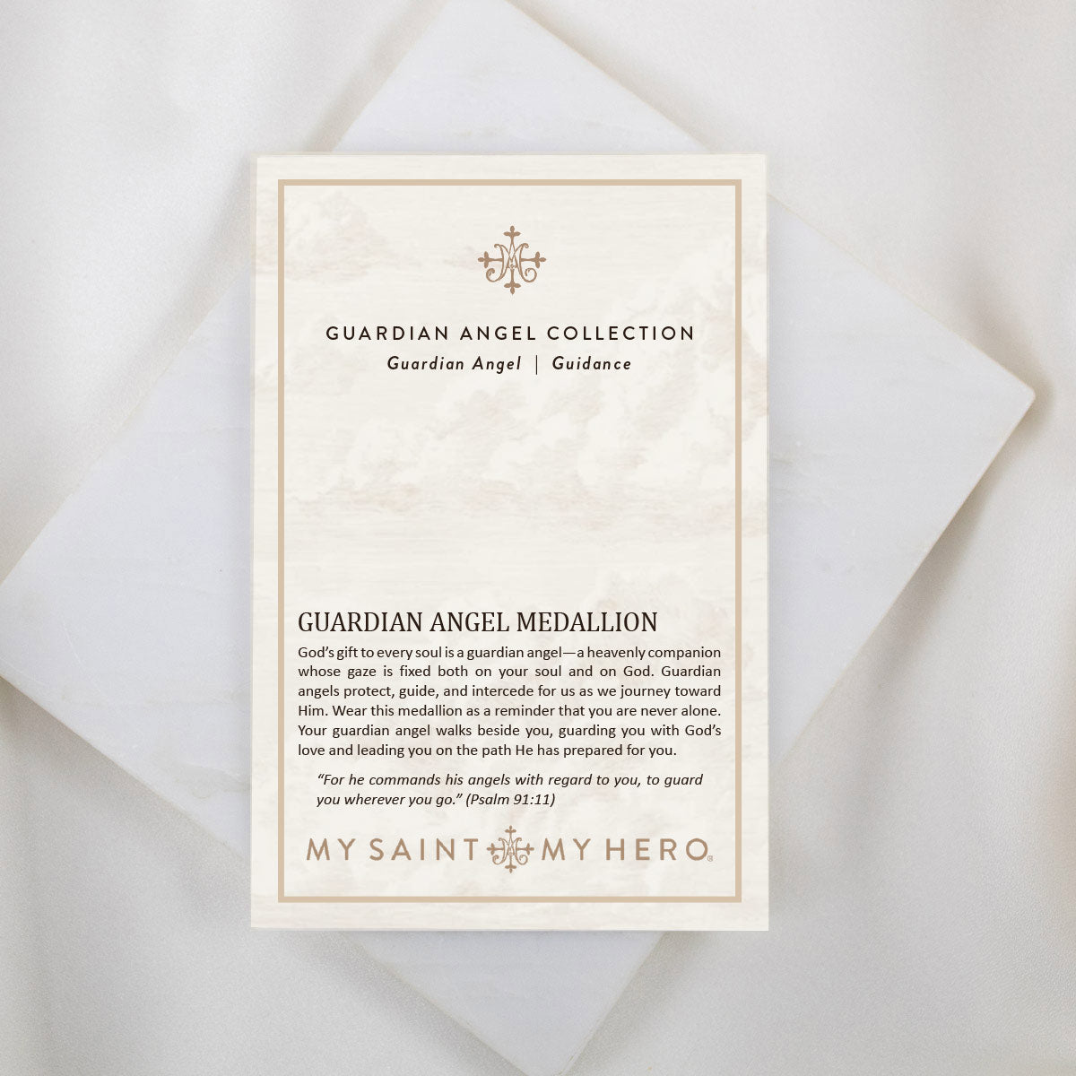 An inspirational product card titled "GUARDIAN ANGEL COLLECTION" featuring the "Archangel Raphael | Guidance" medal description, displayed on a clean white background. The card explains that a guardian angel is a heavenly companion who protects, guides, and intercedes for us. It includes the scripture quote from Psalm 91:11: “For he commands his angels with regard to you, to guard you wherever you go.” The "MY SAINT MY HERO" brand name is visible at the bottom.