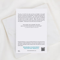 A white rectangular card with printed inspirational text and a QR code, photographed on a light marble surface with a white satin ribbon draped across the top. The card appears to be the product being sold rather than an auxiliary chart or instruction.