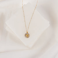 gold tone necklace with a rose and lavender enamel pendant