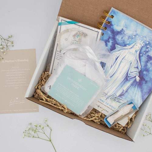 This limited-edition bundle includes St. Gerard Blessings for a Healthy Pregnancy Bracelet, Wonderfully Made Onesie, Mother Mary, Mother Me Devotional Journal and a Petite Mary Statue, and an inspirational card with A Mother's Blessing Prayer in a gifting box.