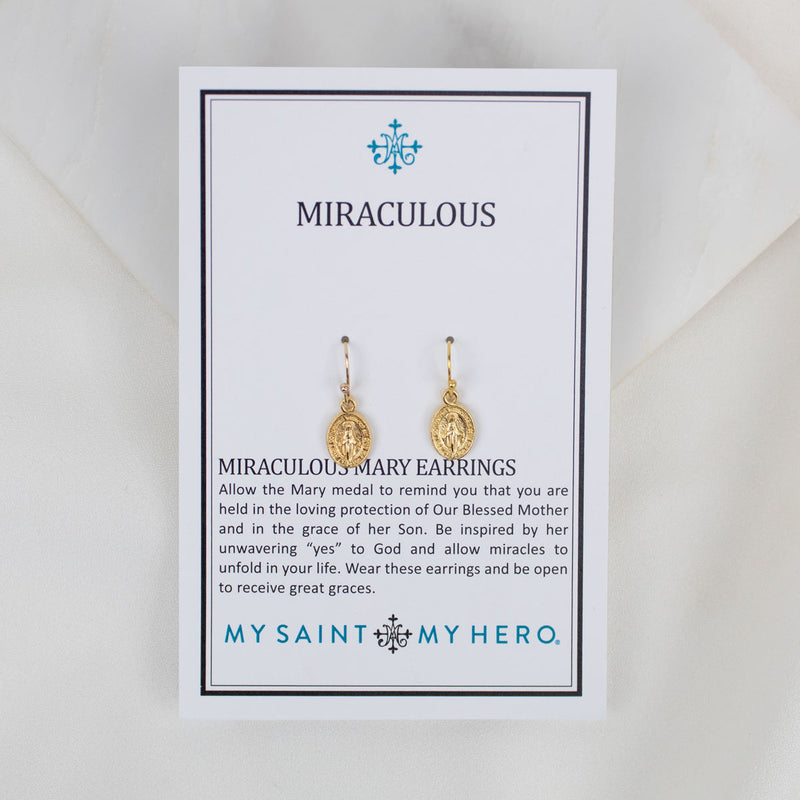 Gold-tone Miraculous Medal Earrings displayed on their inspirational 'My Saint My Hero' product card.