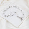 Rosary Wrap Bracelet with white and gray crystals and silver tone crucifix, Miraculous Mary medal and Benedictine medal