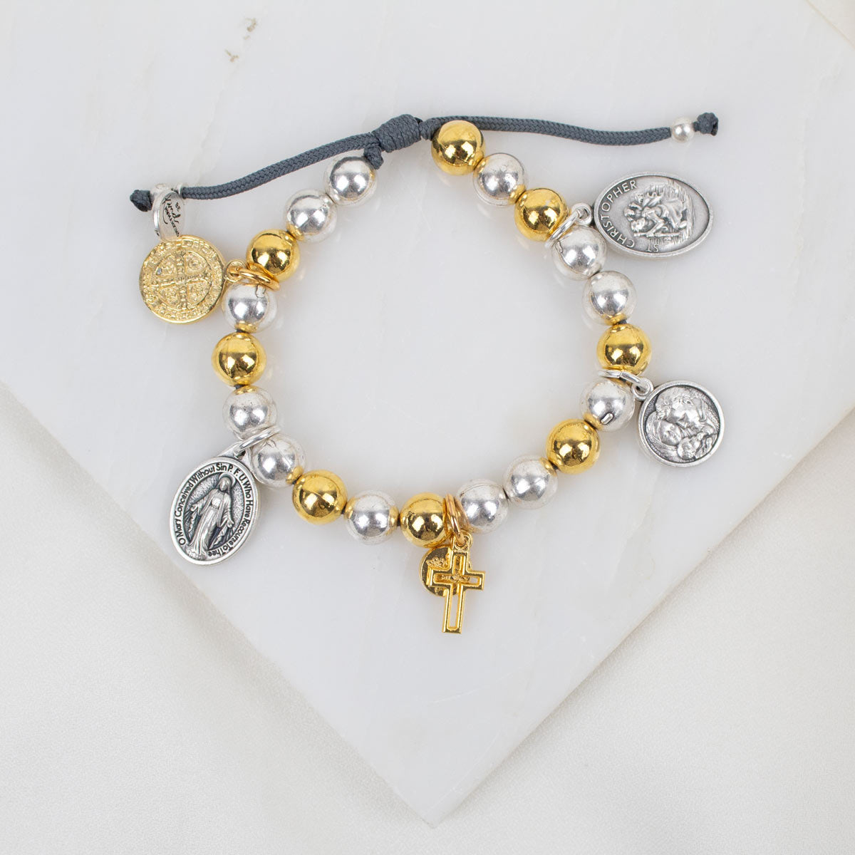 Saints & Heroes Charm Bracelet with gold and silver-tone beads and Italian saint medals.
