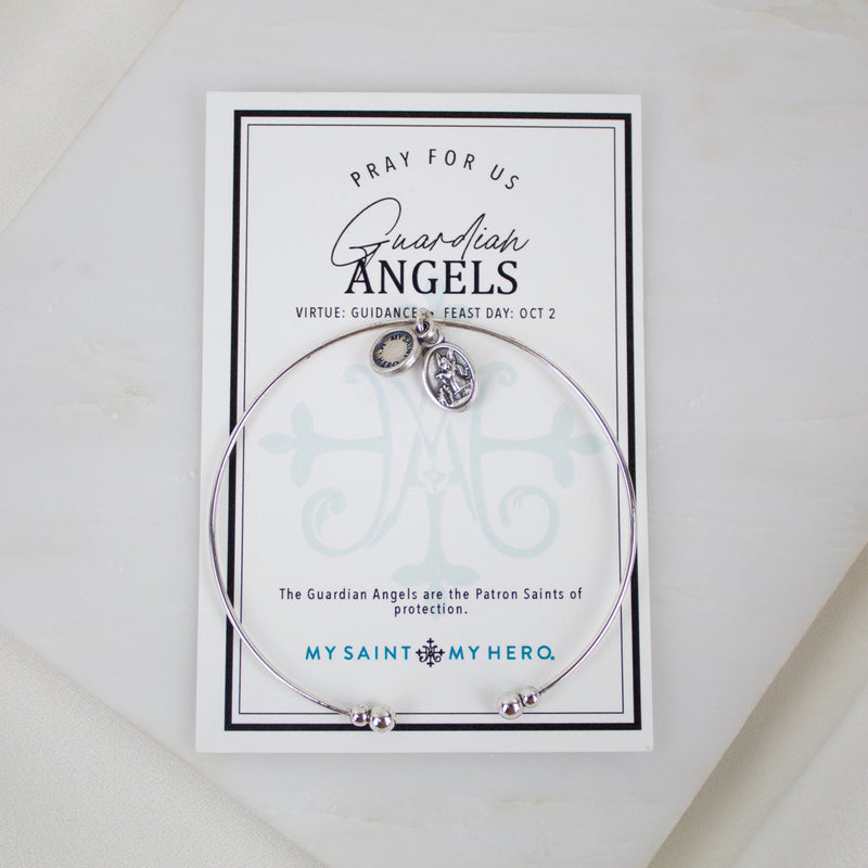 Silver-tone Archangel Michael and Guardian Angel medal charm on a whisper bangle cuff, displayed on its inspirational product card.