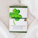 St. Patrick's Day green crystal and gold Benedictine Medal Bracelet on a St. Patrick's Shamrock gifting card