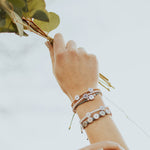 Close up of wrist wearing the Little Flower Bracelet and matching Morning Mantra and Well Wishes Bracelets