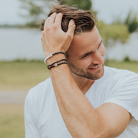Man Wearing Virtue Gemstone Bracelets and Peace Agate Bracelet