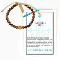 A Father's Love beaded bracelet with brown and gold tiger's eye beads, a gold-toned 'FAITH' charm, and a gold-toned central medallion, displayed on its white gift card which reads 'FATHER'S LOVE' by 'MY SAINT MY HERO'.