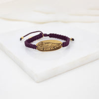 MERLOT bracelet with a gold WING MEDAL  on worven cording 