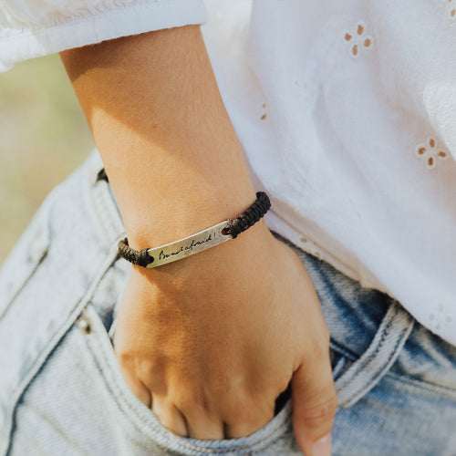 Be Not Afraid Handwoven Blessing Bracelet on a woman's wrist (in Pope John Paul II handwriting)
