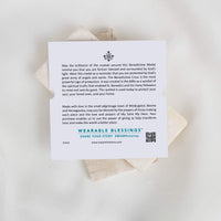 A white rectangular card with printed text against a light neutral background.