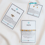 Gold Tone cross ring, petite earrings, woven bracelet on inspirational cards