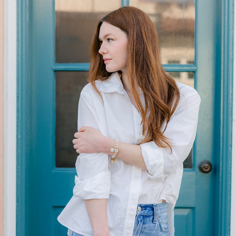 Daughter of the King Bracelet pearl and jubilee st. benedict medal bracelet worn on red head model with matching jubilee enamel gold chain bracelet