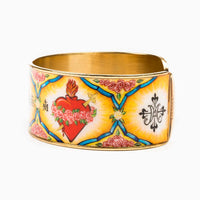 Gold-tone plated Holy Family Everlasting Heart of God Cuff bracelet featuring a detailed, colorful sacred icon printed with epoxy. The icon includes the Sacred Heart of Jesus, the Immaculate Heart of Mary, and the Pure Heart of St. Joseph woven together, displayed against a clean, white textured stone background.
