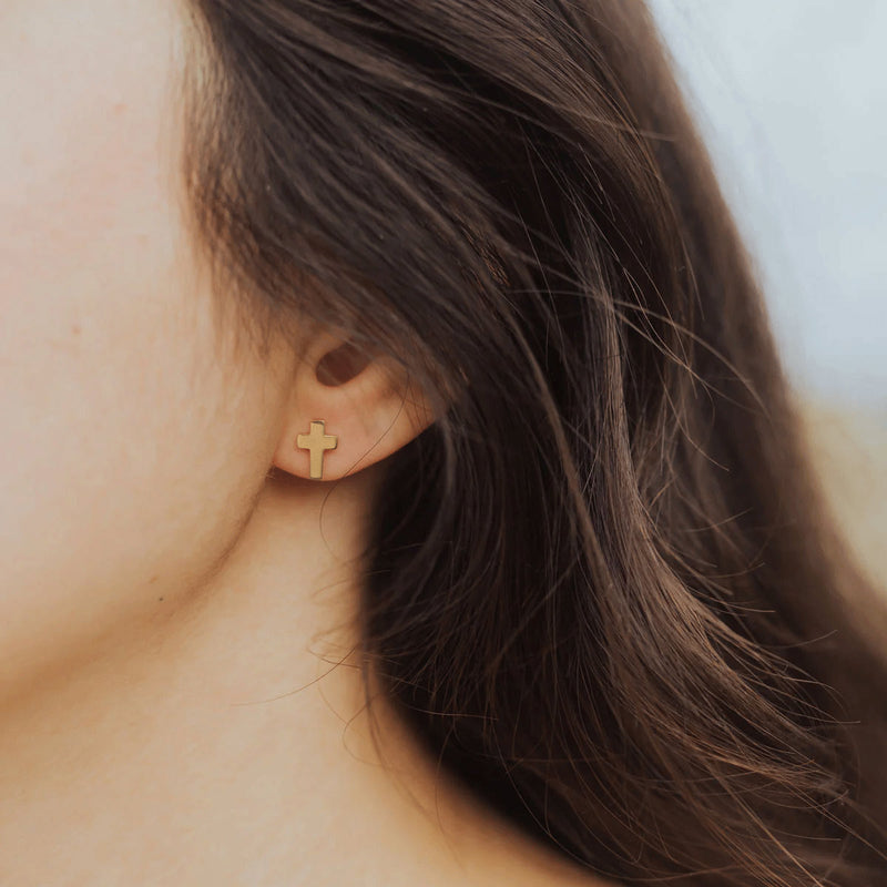 Faith Petite Cross Earrings worn by woman with brown hair