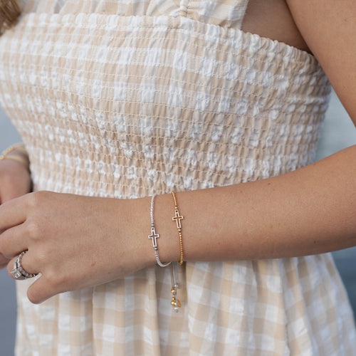 Filled by Faith Bracelets in silver and gold and a woman's wrist