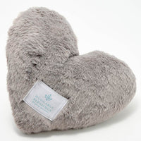 A plush, gray weighted pillow in the shape of a heart with a label that reads 'Huggable Blessings'.