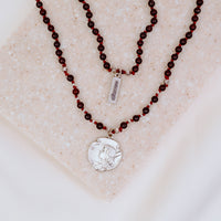 Silver Joan of arc medal on a handbeaded gemstone necklace