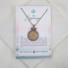 Necklace with decorative pendant on a 'My Saint My Hero' card with text