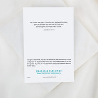 Card with inspirational quote and branding on a white background