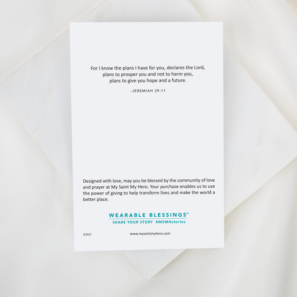 Card with inspirational quote and branding on a white background