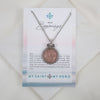Necklace with pink textured pendant on a 'My Saint My Hero' card with text and logo.