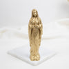 Gold statue of a Our Lady of Lourdes   religious figure on a white base