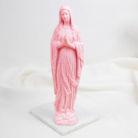 Pink Our Lady of Lourdes statue of a religious figure on a white background