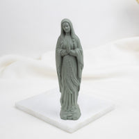 Cactus Our Lady of Lourdes  statue of a religious figure on a white base with a white background