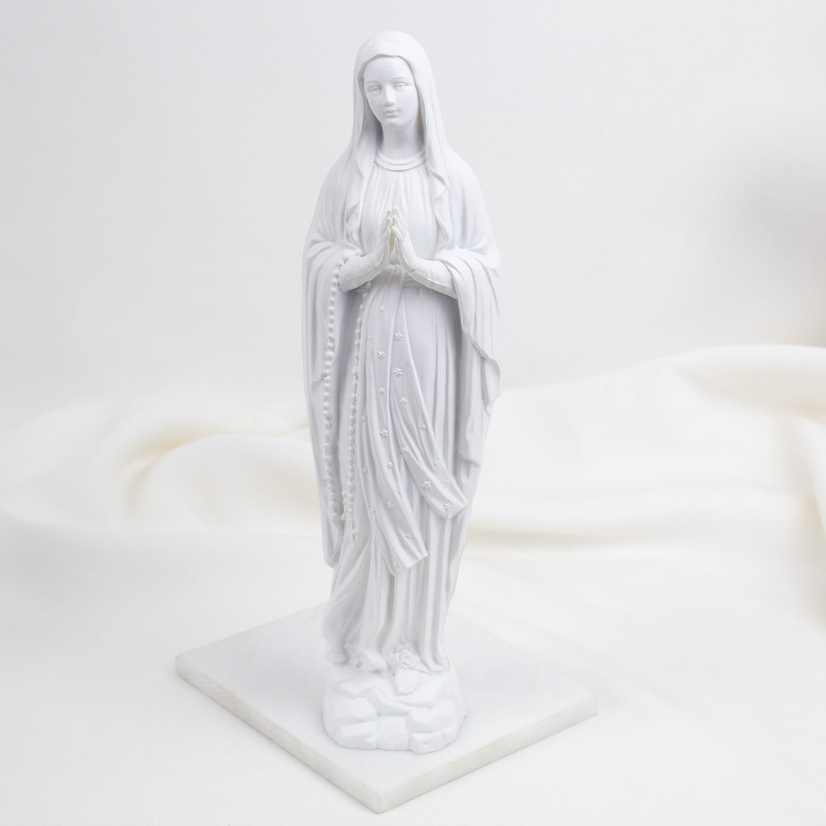 White  Our Lady of Lourdes statue of a religious figure on a white background