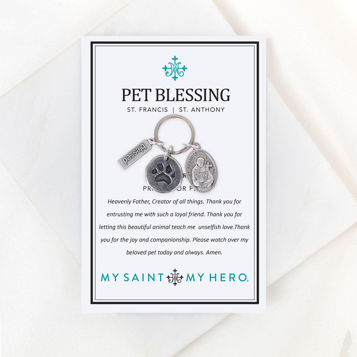 Pet blessing keychain with prayer card on a white background