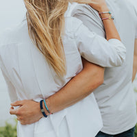 couple wearing red white and blue Americana collection Blessing Bracelets