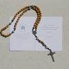 Novena gifting card with wooden and amazonite handmade rosary on top