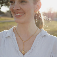 Woman wearing St. Christopher Protection & Guidance Necklace