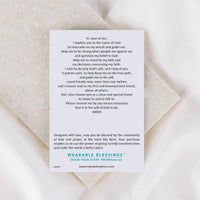 Card with prayer text on a beige background