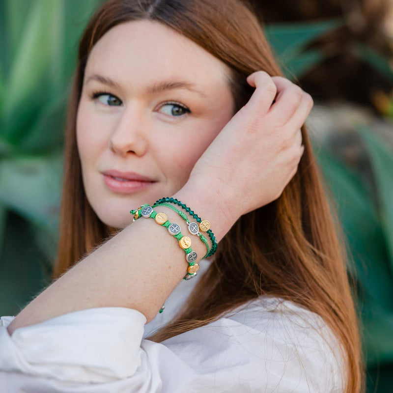 Woman wearing green handwoven bracelets
