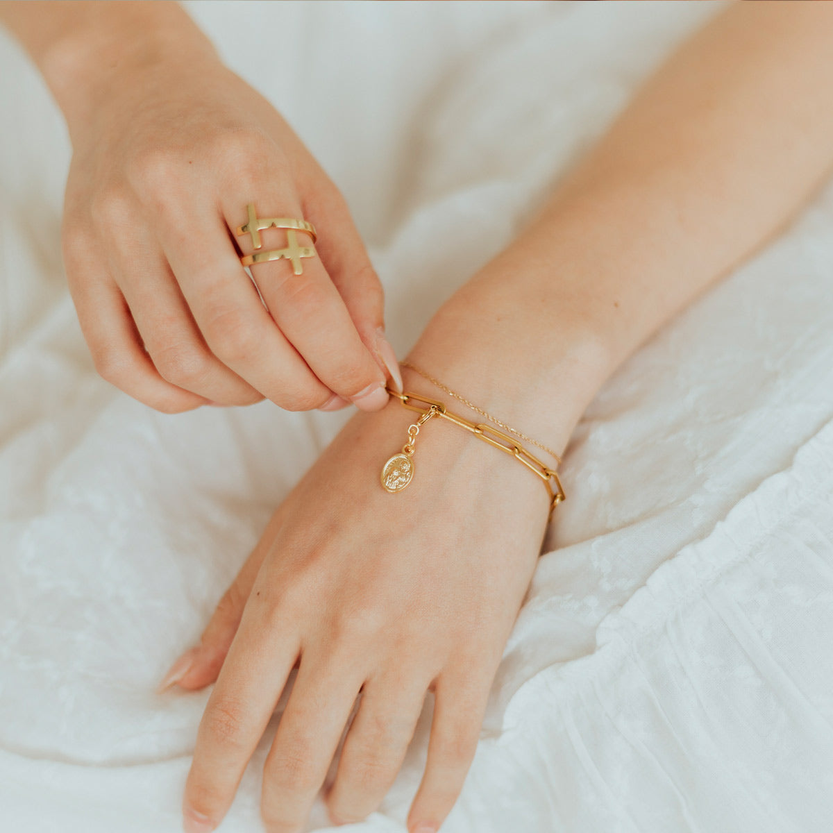 Saint Anne Medal worn on gold tone paper clip style chain bracelet